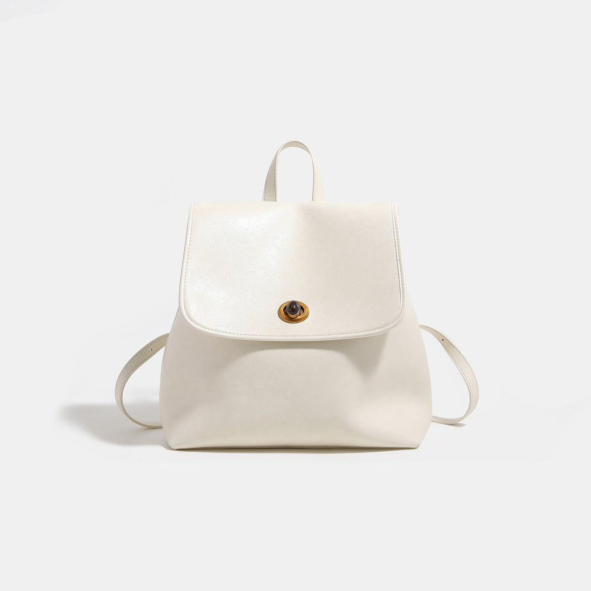 Structured flap backpack purse with round gold-tone clasp, top handle, and twin shoulder straps, front view