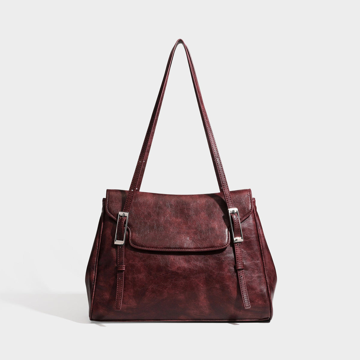 Large structured shoulder tote bag in wine red textured leather-look finish with front flap closure and silver-tone buckle