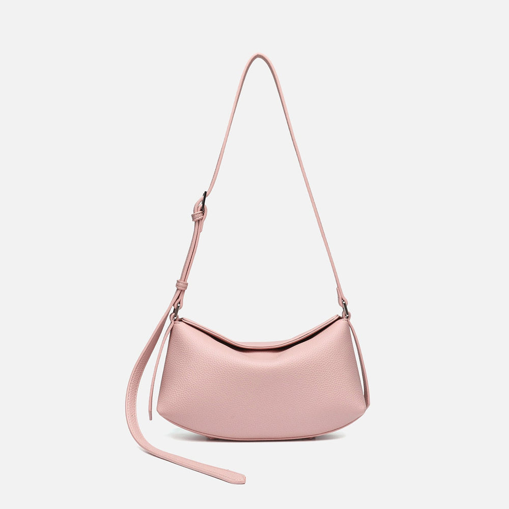 Compact crescent saddle bag with pebbled leather-look finish and adjustable shoulder strap, front view
