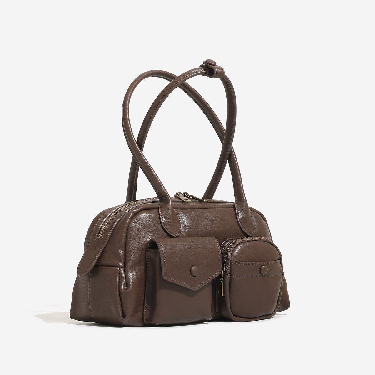 Structured matte leather-look bowling bag with snap-flap and zip front pockets, looped top handles, and antique gold-tone