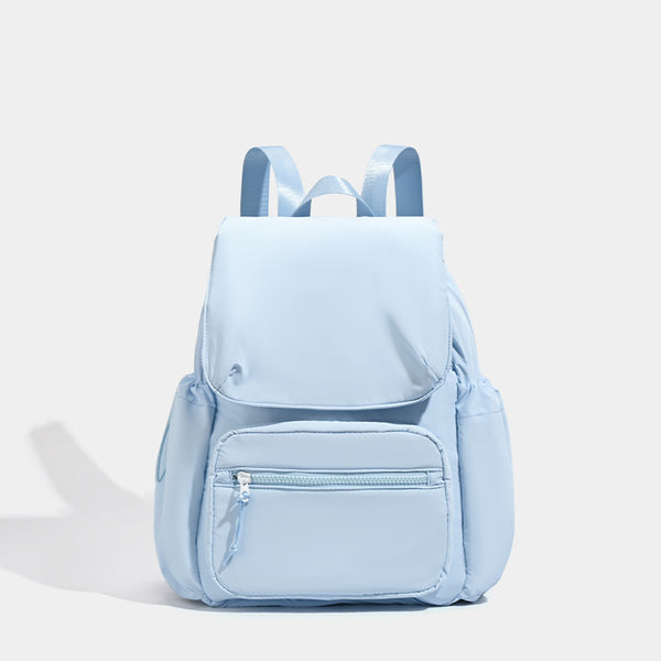 Soft matte nylon flap backpack with front zip pocket and side drawcord pockets, detail view 7