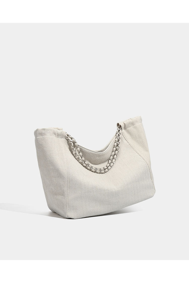 Large slouchy denim tote bag with silver-tone chain strap and contrast topstitching, detail view 12