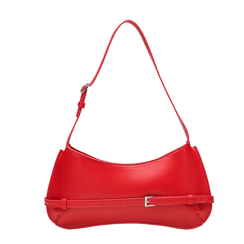 Curved baguette shoulder bag with front buckle strap and adjustable thin strap in glossy leather-look finish, detail view 5