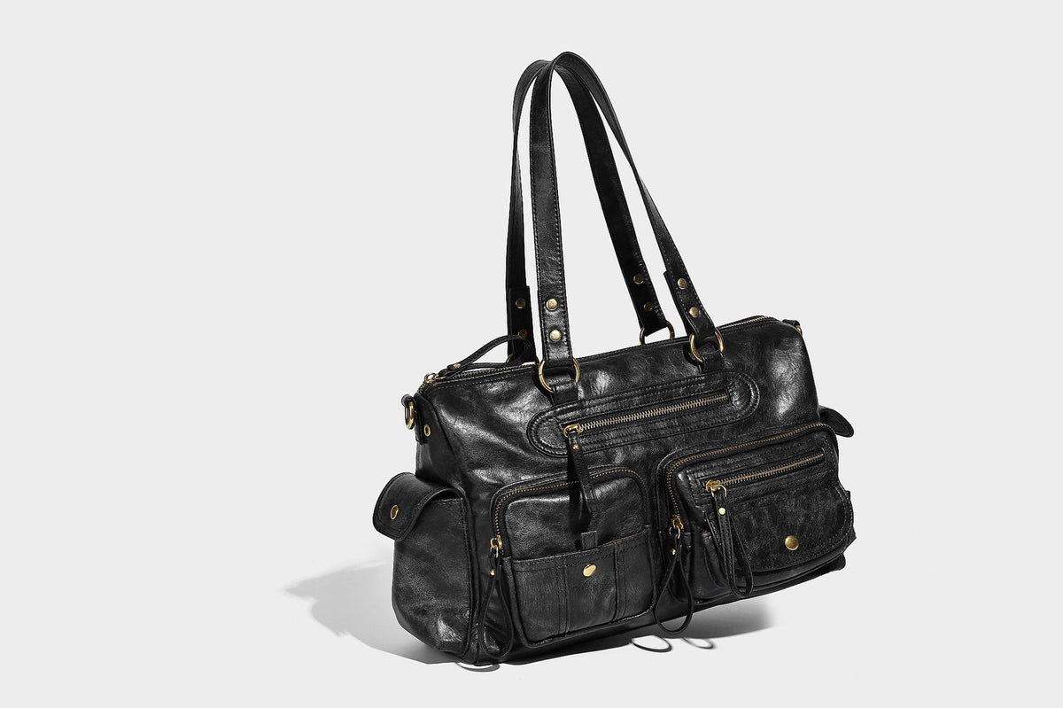 Distressed leather-look vintage satchel shoulder bag with multiple front zip pockets, dual top handles, and brass-tone