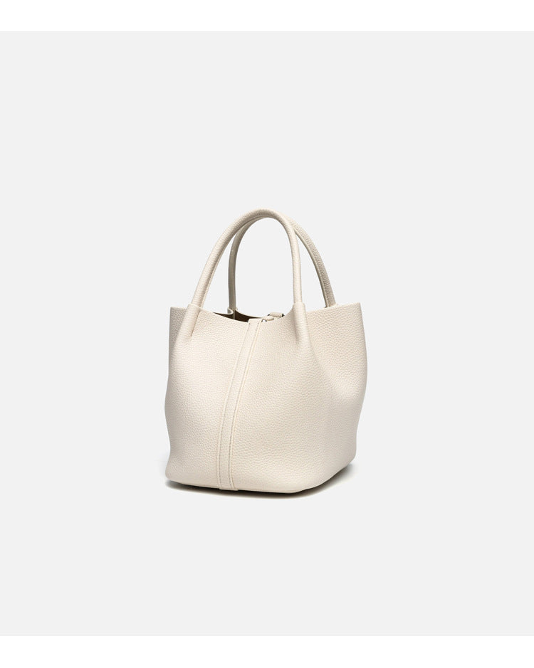 Pebbled leather-look bucket tote bag with rounded top handles and detachable shoulder strap, detail view 17