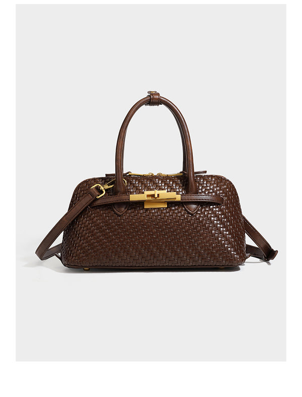 Structured woven-embossed leather-look satchel with dual rolled top handles, gold-tone turn-lock closure, and detachable