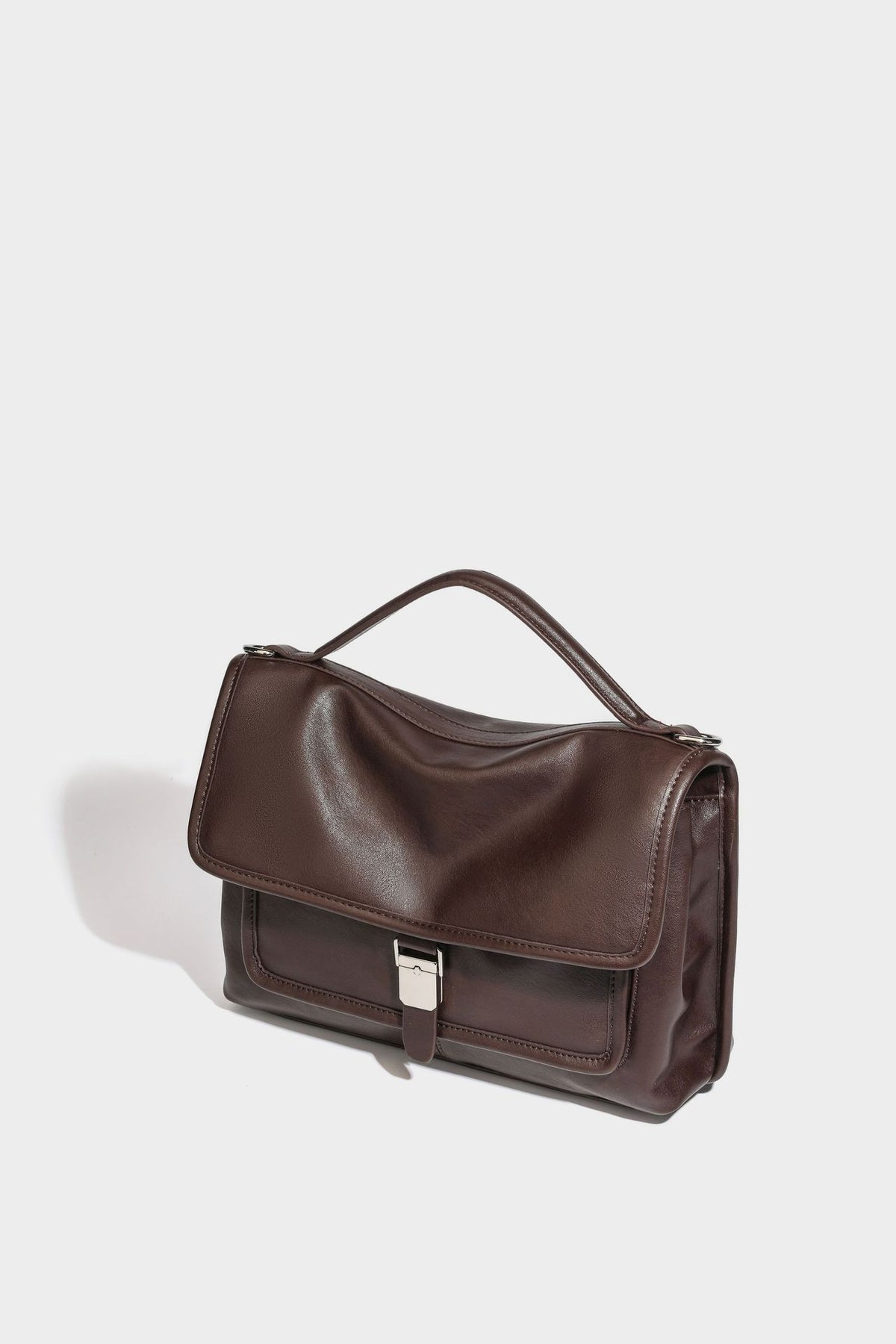 Structured rectangular satchel bag in dark espresso brown with smooth leather-look finish, flap front with silver turn-lock