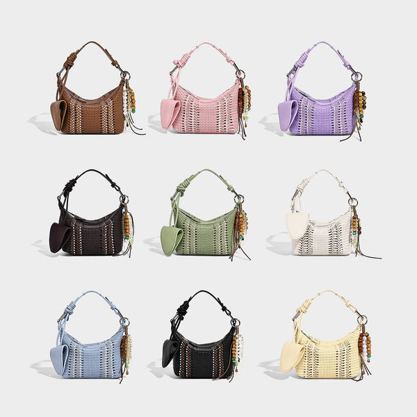 Small woven crescent shoulder bag with leather-look trim, zip closure, silver-tone ring hardware, and beaded tassel charm