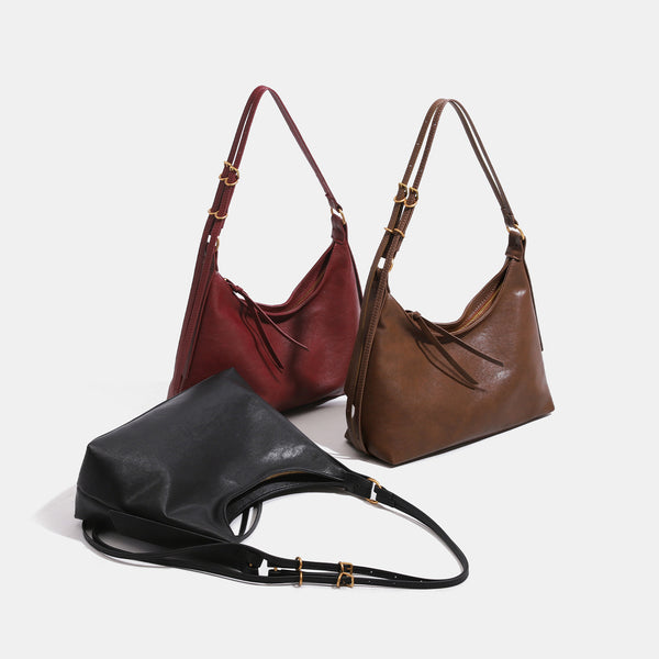 Slouchy hobo shoulder bag in smooth leather-look finish with gold-tone hardware and adjustable strap, detail view 2