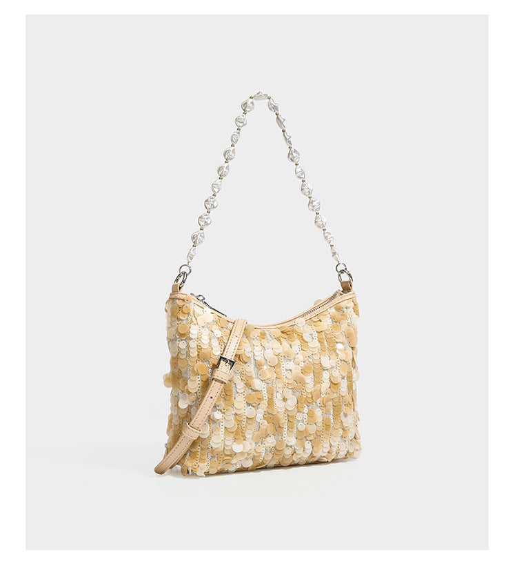 Champagne and ivory large-disc sequin shoulder bag with baroque faux-pearl beaded chain strap and silver-tone zip closure