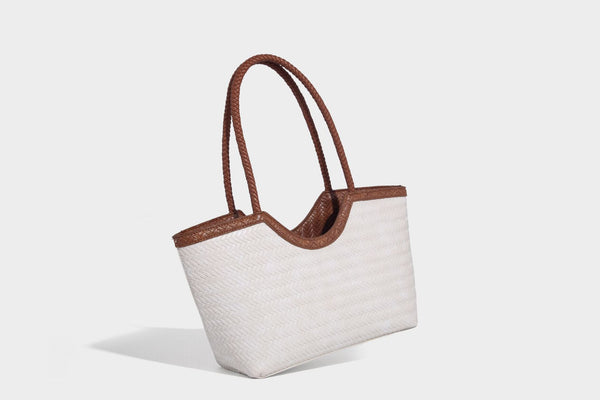 Large open-top woven tote bag with contrasting braided double handles and matching drawstring pouch, detail view 24