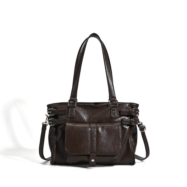 Large glossy leather-look tote bag with front flap pocket, silver-tone buckle hardware, dual top handles and detachable