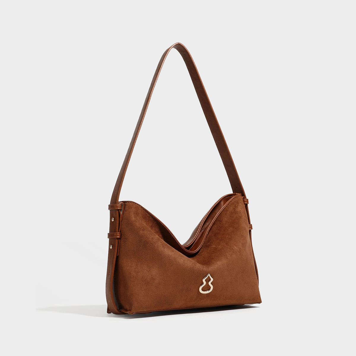 Slouchy suede-finish brown shoulder bag with long single strap and small gold-tone logo emblem on front, detail view 7