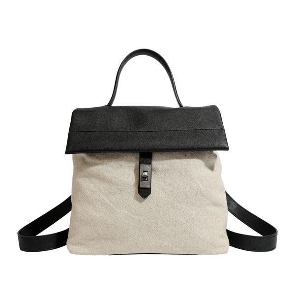 Strukturierter Rucksack in beige aus gewebtem Canvas mit schwarzer Klappe in Lederoptik, Drehverschluss, Tragegriff und flachem Schulter