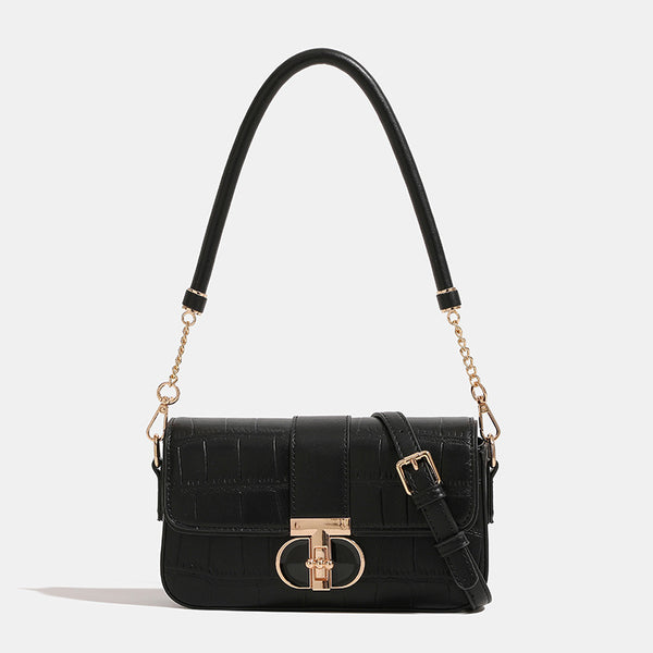 Small crocodile-embossed flap crossbody bag with circular gold turn-lock closure and chain strap, detail view 7