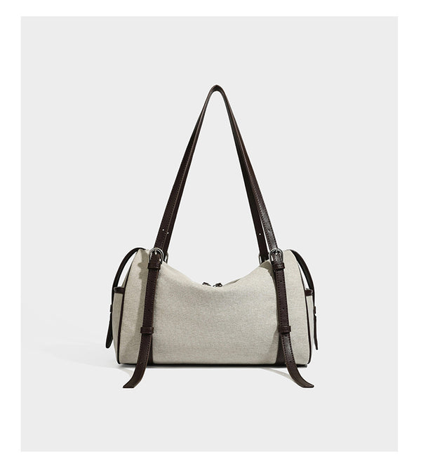 Cream canvas barrel shoulder bag with dark brown leather-look straps, trim, and silver-tone hardware, detail view 11