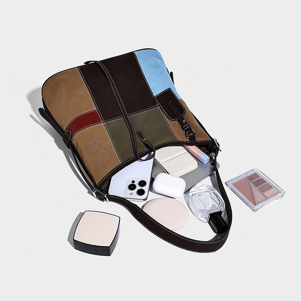 Patchwork bucket tote shoulder bag with tan, dark brown, olive, red, and sky blue color-block panels, white contrast, detail