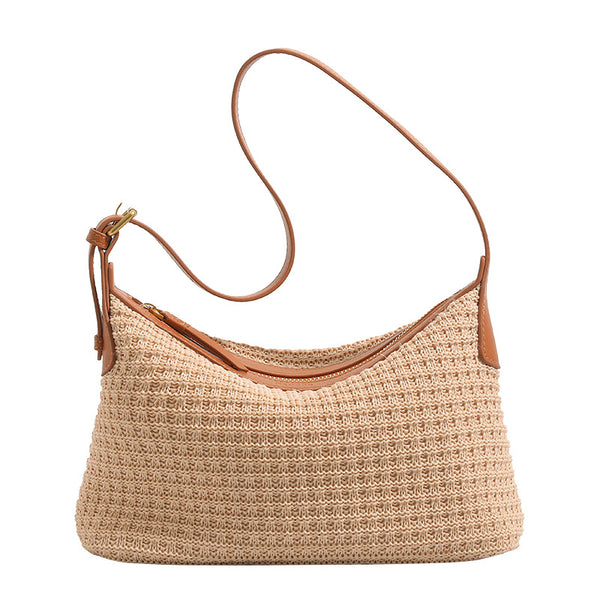 Beige woven raffia-style hobo shoulder bag with caramel leather-look trim, gold-tone zip closure, and adjustable strap
