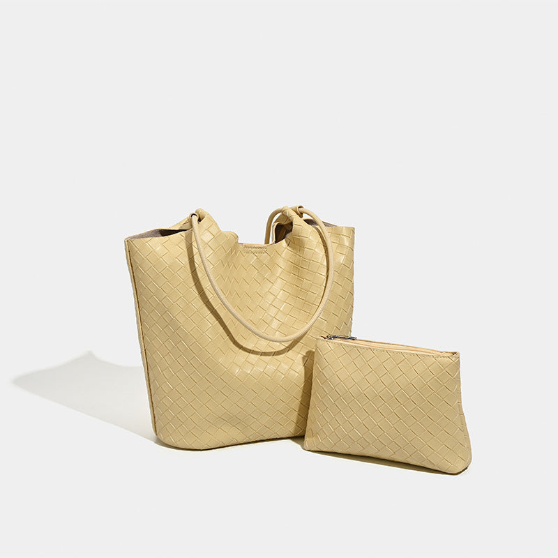 Large woven-texture open-top tote bag with single shoulder strap in butter yellow, detail view 2
