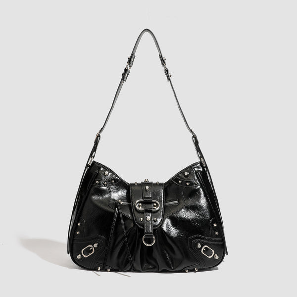 Black glossy studded hobo shoulder bag with silver rivet hardware, front buckle accent, and adjustable strap, front view