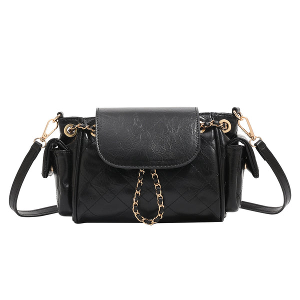 Small quilted leather-look flap bag with gold-tone chain strap and diamond stitch pattern, detail view 5