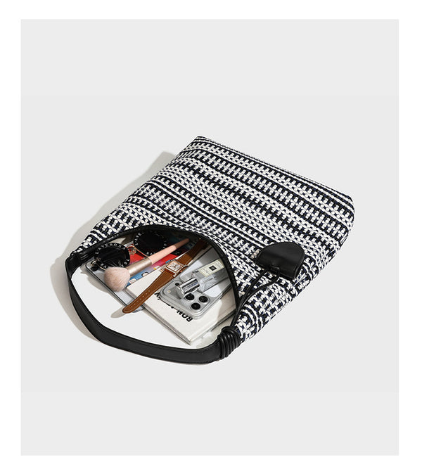 Slouchy woven stripe hobo shoulder bag with black-and-white pattern and leather-look strap, detail view 13
