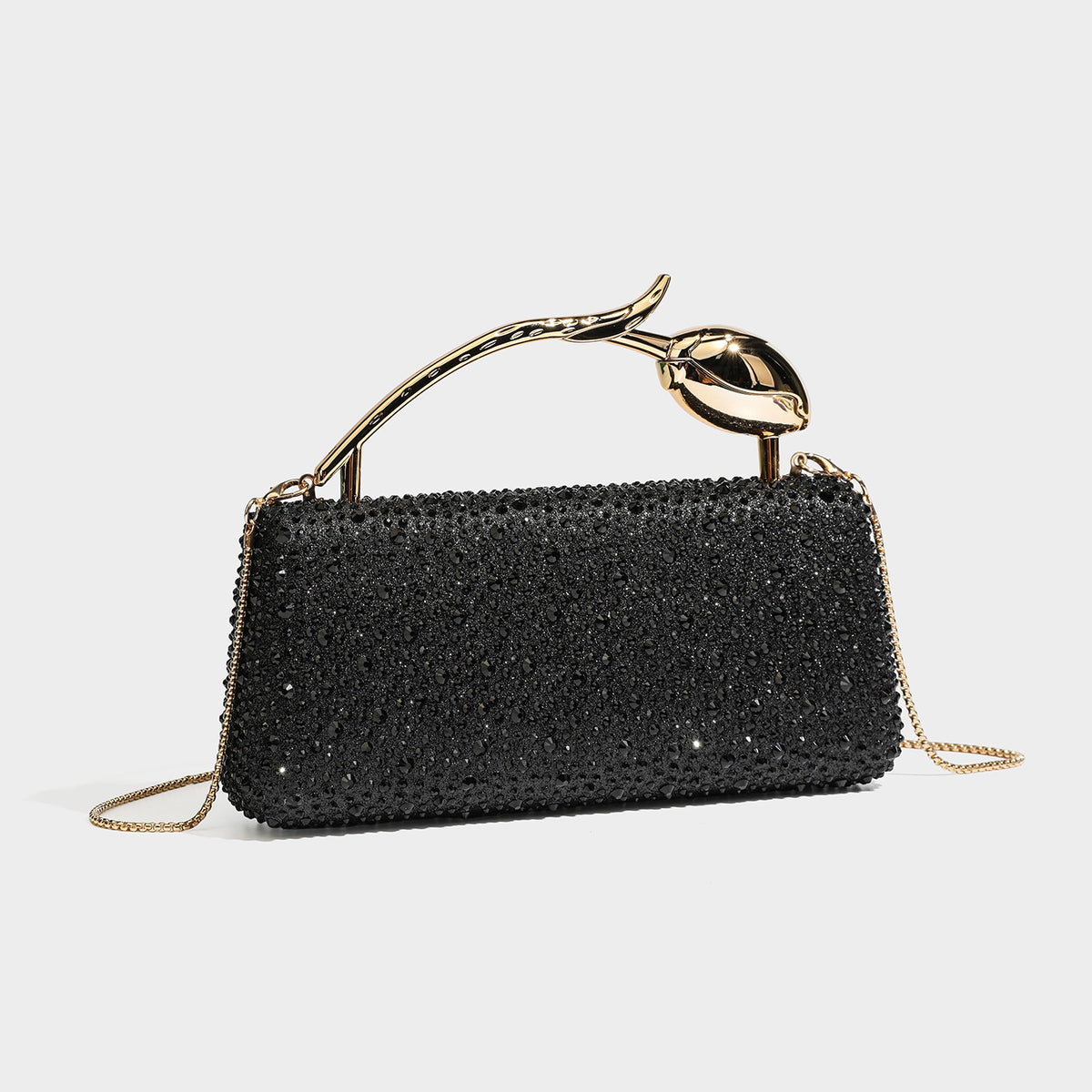 rectangular hard-case rhinestone evening clutch with sculptural gold-tone branch-and-bud top handle and detachable chain