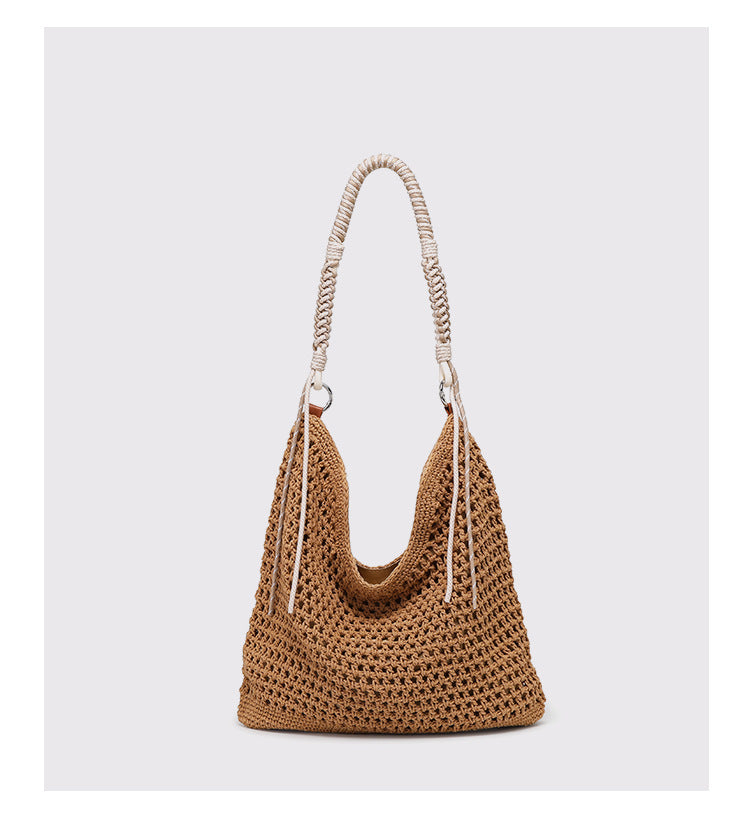 Große cremefarbene Hobo-Schultertasche aus Flechtmaterial mit geflochtenem Kordelriemen und Ringbeschlägen in Silberoptik, Detailansicht 12