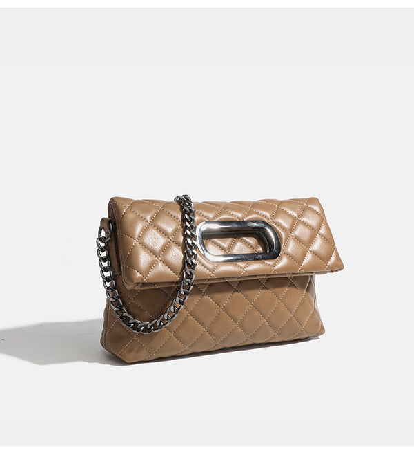 Quilted diamond-stitch flap crossbody bag with gunmetal chain strap and cut-out bar handle, detail view 15