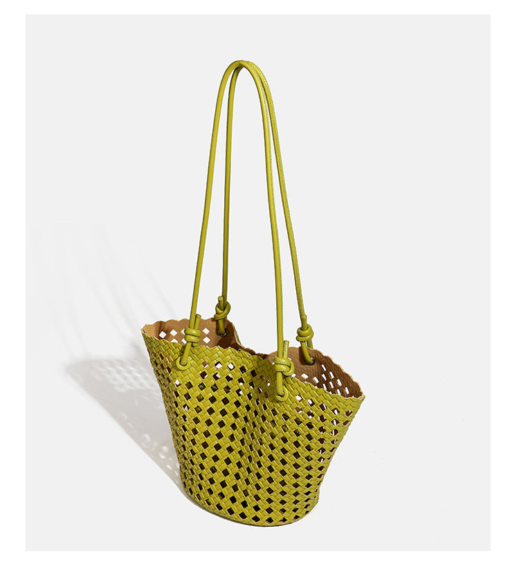 Open-weave lattice bucket tote bag with long knotted cord handles and tapered silhouette, detail view 14