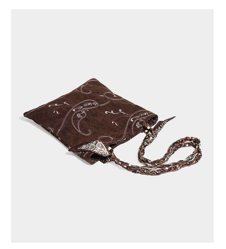 Brown suede-finish tote bag with paisley embroidery and braided fabric-ribbon shoulder strap, detail view 27