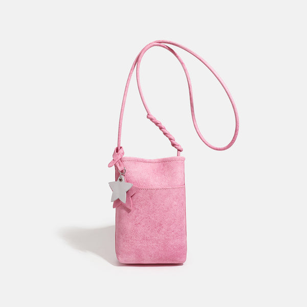 Small vertical textured mini crossbody phone bag with long braided cord strap and silver-toned star charm, detail view 6
