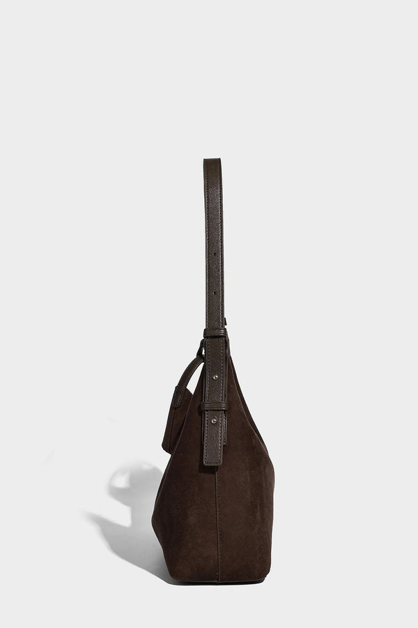 Dark brown suede-look hobo shoulder bag with top zip closure, adjustable strap, and small detachable mini pouch, detail view