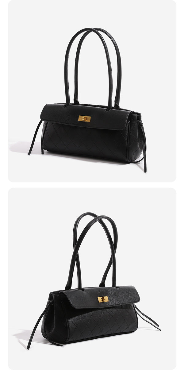 Structured black baguette bag with diamond-quilted front panel, gold-tone turn-lock flap closure, and dual looped top