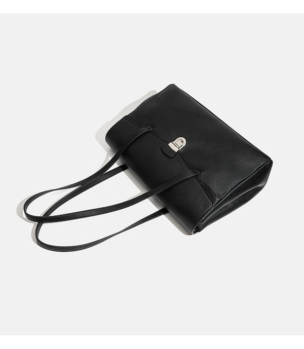 Structured black pebbled-finish flap tote bag with silver turn-lock clasp and long double shoulder straps, detail view 9
