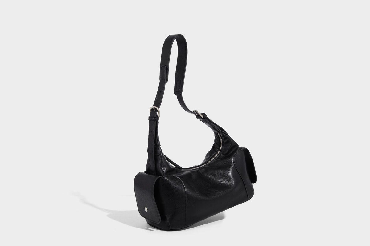 Soft pebbled leather-look hobo shoulder bag with zip top closure, side flap pockets, and silver-tone hardware, detail view 16