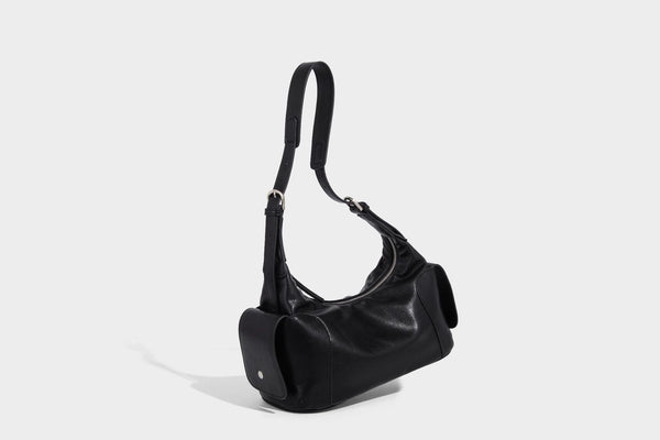 Soft pebbled leather-look hobo shoulder bag with zip top closure, side flap pockets, and silver-tone hardware, detail view 16