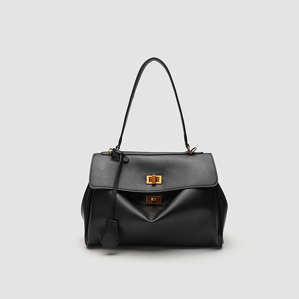 Structured black leather-look flap satchel bag with silver turn-lock hardware and top handle, detail view 6