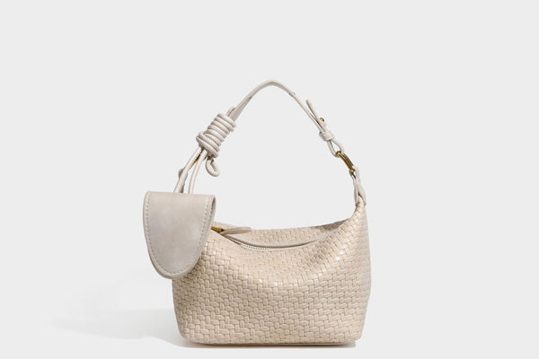 Small glossy basket-weave hobo shoulder bag in brown with knotted top handle, flap accent pocket, and gold-tone hardware
