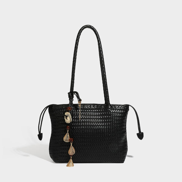 Structured woven leather-look tote bag in dark brown with long shoulder straps, side drawstring ties, and gold filigree