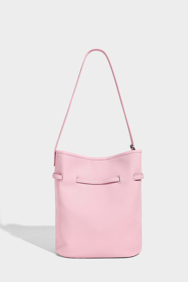 Small pebbled leather-look bucket bag with front drawstring toggle hardware and long adjustable shoulder strap, detail view