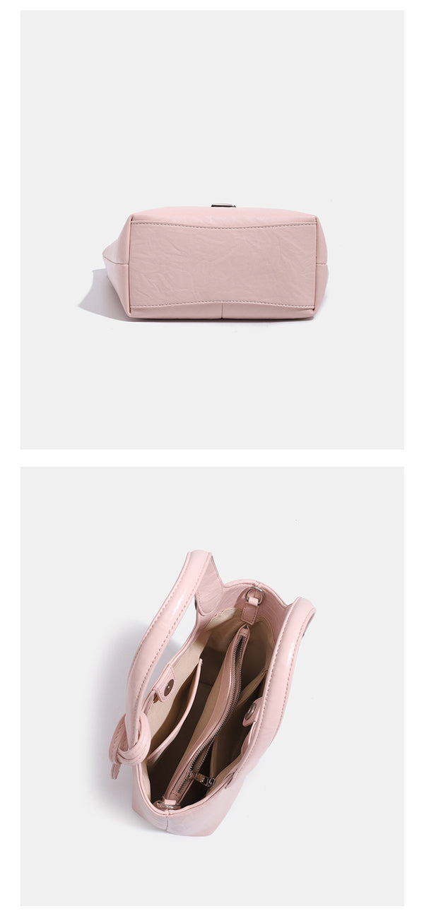 Soft glossy leather-look bucket tote bag with twin handles and detachable crossbody strap, detail view 13
