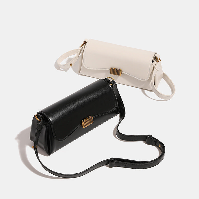 Structured leather-look baguette shoulder bag with gold-tone rectangular clasp and adjustable strap, front view