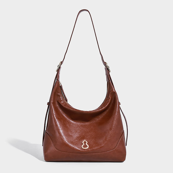 Glossy leather-look slouchy hobo shoulder bag with zip closure, gold-tone hardware, and adjustable strap, detail view 6