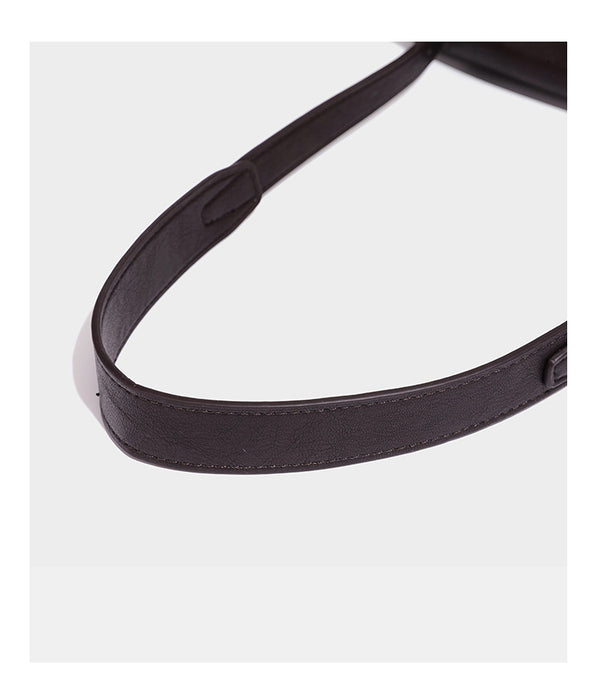 Structured rectangular flap shoulder bag in dark brown leather-look finish with long single strap and layered front panel