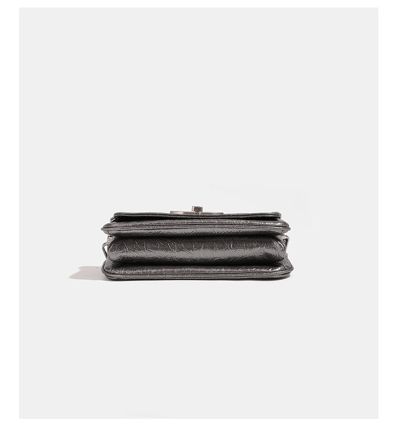 Rectangular flap shoulder bag with chunky silver-tone chain strap and crinkled leather-look finish, detail view 9