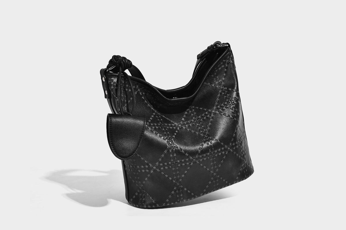 Diamond-quilted leather-look bucket shoulder bag with knotted strap accent and attached mini pouch, detail view 19