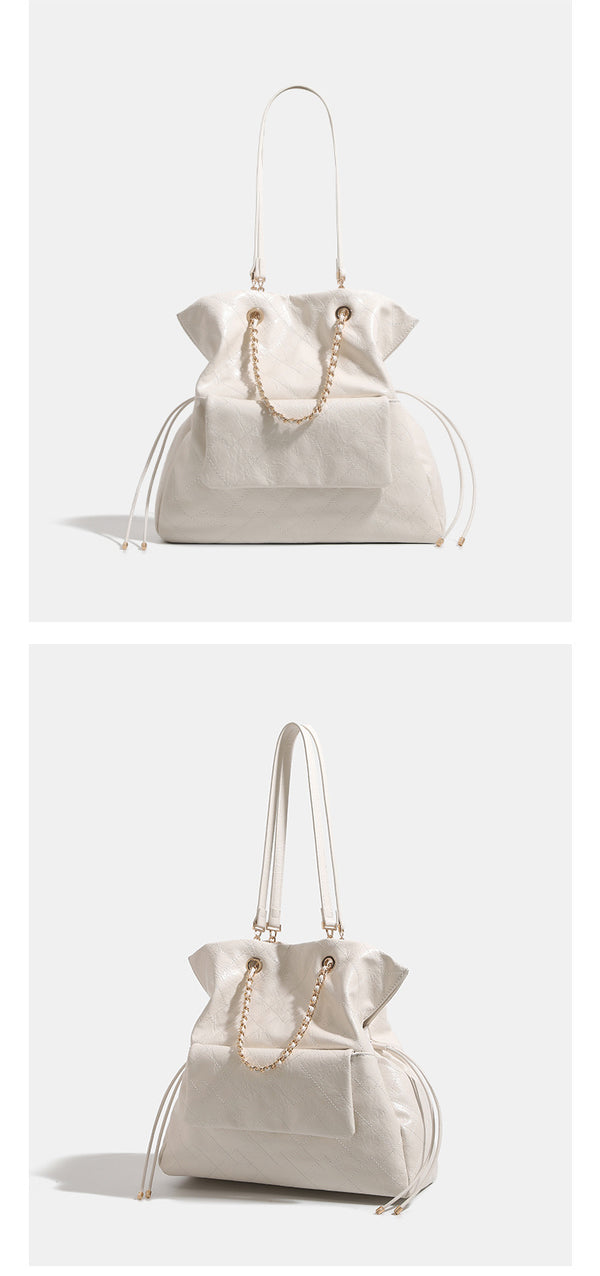 Quilted crinkled leather-look convertible tote backpack with gold-tone chain handles and drawstring closure, detail view 8
