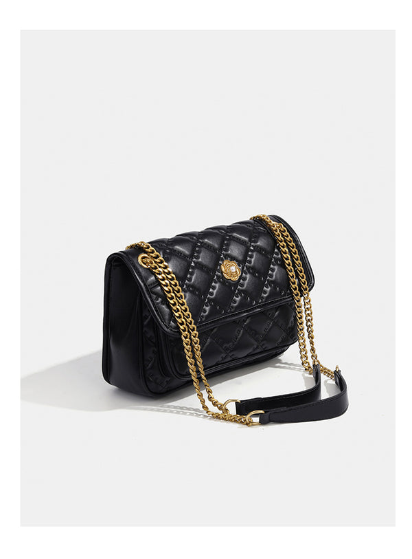 Compact diamond-quilted flap shoulder bag with gold-tone chain strap and floral turn-lock clasp, detail view 14