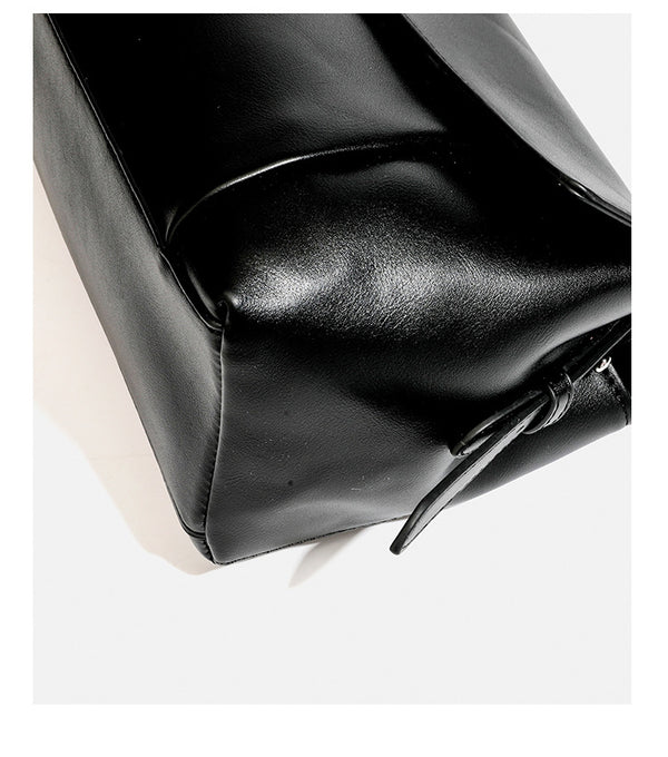 Structured rectangular flap shoulder bag with smooth leather-look finish, silver-tone turn-lock clasp, and long slim